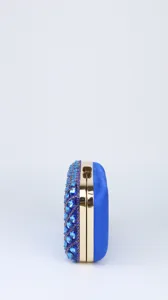 Blue rhinestone evening clutch bag detail, gold metal frame, elegant party wedding purse.