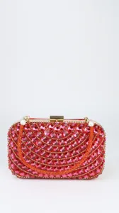 Close-up detail of a stunning red crystal evening clutch bag with sparkling rhinestones.
