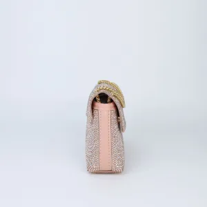 Side profile detail of the sparkling rhinestone evening shoulder bag with chain strap.