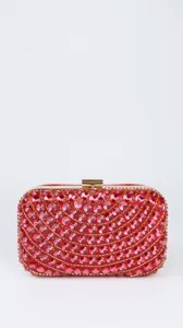 Sparkling red rhinestone evening clutch detail with exquisite crystal and gold hardware decoration.