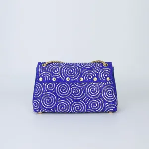 Rhinestone evening shoulder bag, dazzling blue crystal design with gold chain strap details.