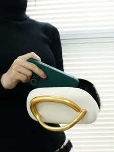 Elegant white evening bag with gold metal handle, stylish metallic box clutch for party.