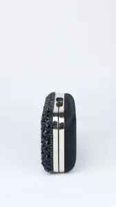 Side view detail of a black rhinestone evening clutch bag for party and wedding events.