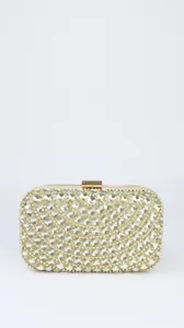 Detail view of a luxury gold crystal evening clutch bag, sparkling rhinestone design.