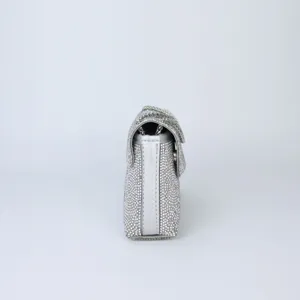 Side view of a stunning silver rhinestone shoulder bag, sparkling crystal evening handbag.