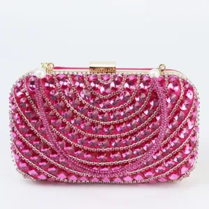 Pink rhinestone evening clutch bag for women, elegant crystal party purse with gold hardware.