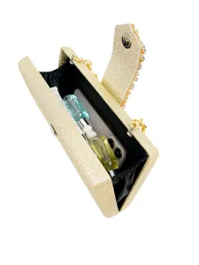 Gold glitter evening clutch bag open showing interior capacity and compartments clearly.