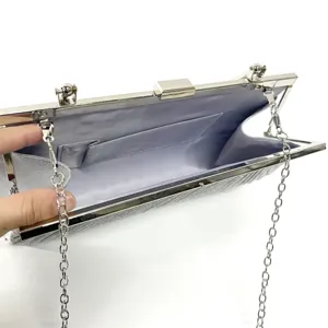 Silver evening clutch bag with metal chain strap, elegant shoulder purse for women.