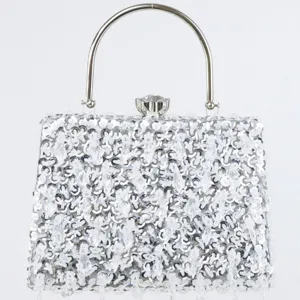 Silver sequined evening clutch bag with metal round handle and crystal clasp for women party.