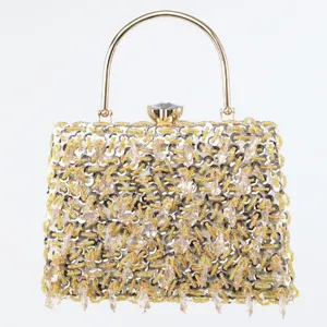 Elegant beaded evening clutch bag with gold metal handle and sparkly crystals for women party.