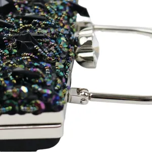 Elegant women evening clutch bag with sparkling iridescent beads and metallic handles for party.