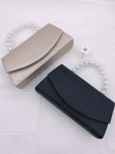 Elegant women evening clutch bag with pearl handle, versatile fashion handbag for wedding.