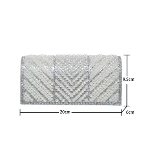 Detailed view of the exquisite handmade pearl and rhinestone evening clutch bag and sizes.