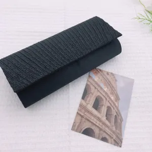Black pleated evening clutch bag with sparkling beaded design, elegant wrist handbag for women.