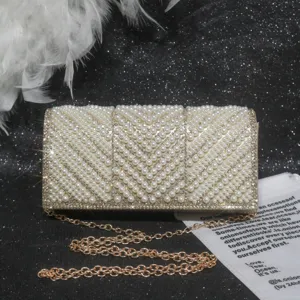 Exquisite pearl rhinestone evening clutch bag detail, elegant gold chain shoulder bag.