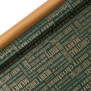 Close-up detail view of green Christmas wrapping paper roll with festive typography design.