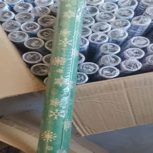 Snowflake gift wrapping paper roll bulk stock for Christmas birthday party packaging details.