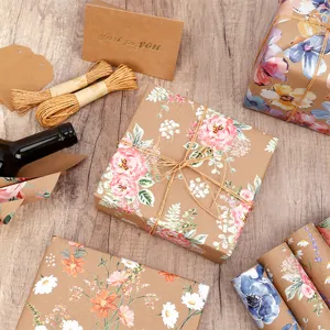 Kraft wrapping paper roll floral gift wrapping set with twine tags and greeting card.