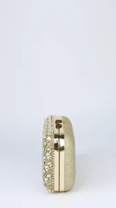 Elegant gold glitter rhinestone evening clutch bag side detail view for women party dress.