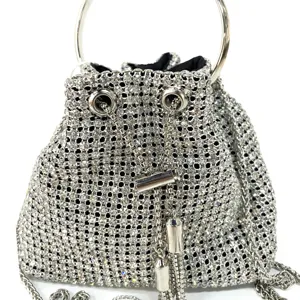 Silver rhinestone bucket evening bag with metal ring handle and crystal mesh for women.