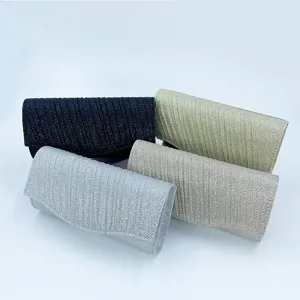Sparkly glitter pleated evening clutch bag detail view showcasing exquisite texture and style.