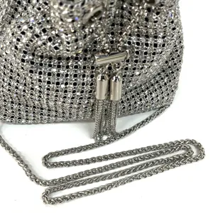Sparkling rhinestone evening bag detail, silver crystal bucket bag with metal chain strap.