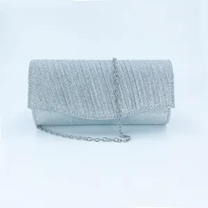 Silver glitter evening clutch bag with chain strap, sparkling pleated party handbag detail view.