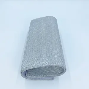 Silver glitter evening clutch detail view, sparkling texture close-up for party bags.