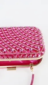 Rhinestone evening bag detail, glamorous pink clutch purse for party and wedding banquet.