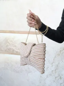 Exquisite pearl beaded evening clutch bag with gold chain strap detail for women elegant events.