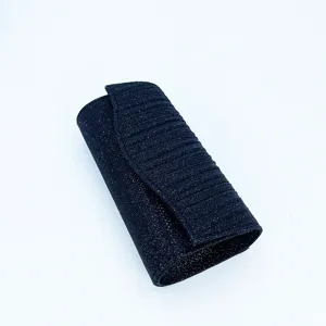 Pleated glitter evening clutch bag detail view, sparkling dark blue party accessory.