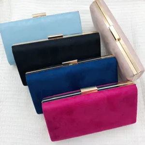 Detailed view of women's suede evening clutch bags featuring elegant metal frames and color options.