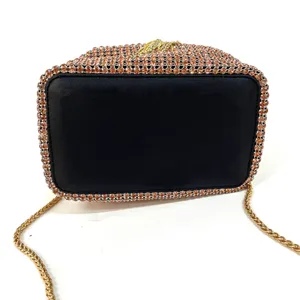 Detailed view of the luxury rhinestone evening bag with sparkling crystals and gold chain strap.