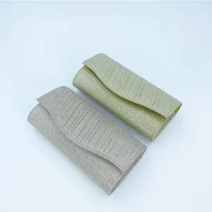 Pleated evening clutch bag for women, elegant party shoulder bag, stylish shimmering design.