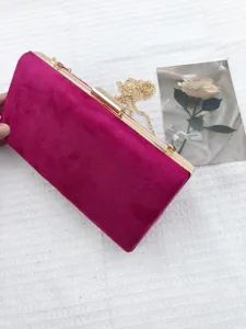Pink velvet evening clutch bag with gold metal frame and chain strap for women events.