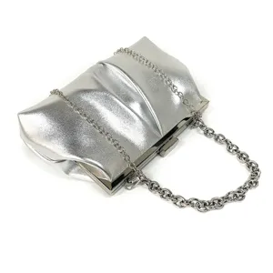 Elegant silver metallic ruched evening clutch bag with chunky chain strap for weddings and parties.