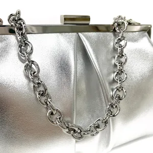 Silver metallic evening clutch bag detail, elegant party handbag with chunky chain strap.