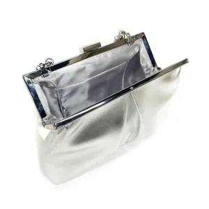Silver evening clutch bag detail, metallic frame purse with chain hook and satin lining.