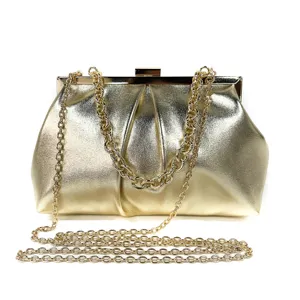 Golden metallic evening clutch bag with chain strap, elegant party purse for women details.