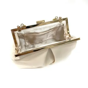 Elegant beige satin evening clutch bag detail, gold metal frame, premium wedding party purse.