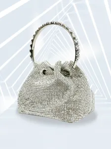 Stunning rhinestone evening bucket bag detail with sparkling crystals and metal ring handle.