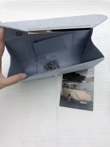 Elegant silver glitter evening clutch bag for women, versatile wedding party handbag.