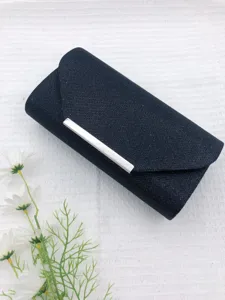Black glitter evening clutch bag with metallic bar detail, perfect accessory for weddings.