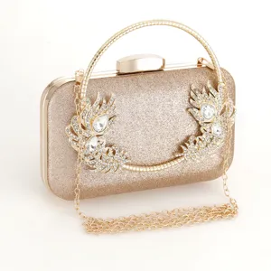 Exquisite gold glitter evening clutch with rhinestone feather detail and metal chain strap.