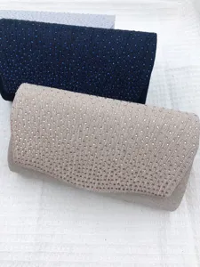 Detailed view of rhinestone pleated evening clutch bags in multiple colors, elegant accessory.