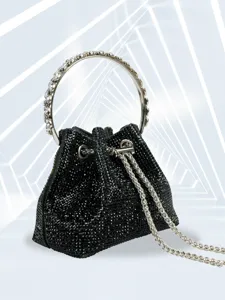 Black rhinestone evening bag detail with crystal metal ring handle and silver chain.
