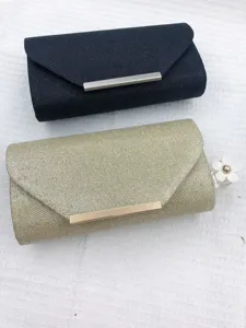 Detail view of sparkly evening clutch bags with metallic bar closure, chic party accessories.
