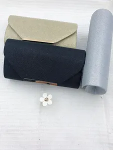 Detailed view of elegant glitter evening clutch bags in gold, black, and silver options.