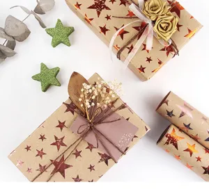 Vintage kraft gift wrapping paper with gold foil stars, perfect for Christmas and birthday gifts.