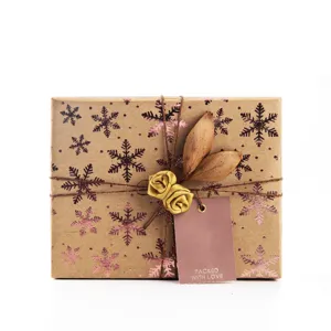 Kraft paper gift box with gold snowflake pattern for holiday and birthday packaging.